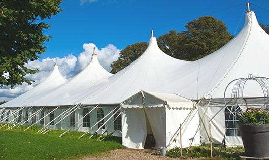 spacious blue portable restrooms organized at a fairground, allowing for comfortable use by individuals of all ages in River Oaks